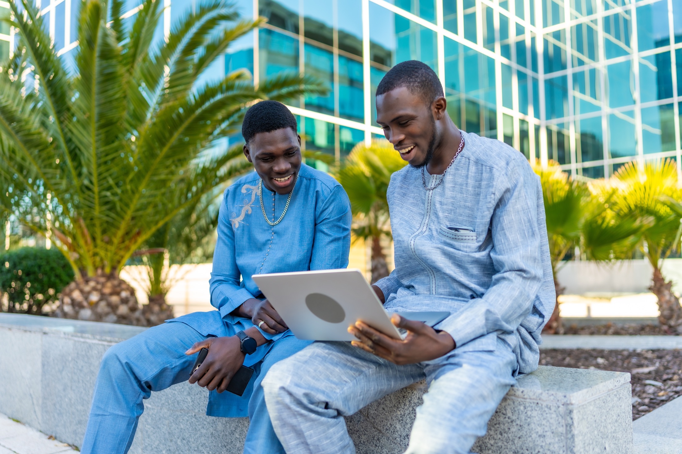 Two African entrepreneurs working with a laptop in Dakar